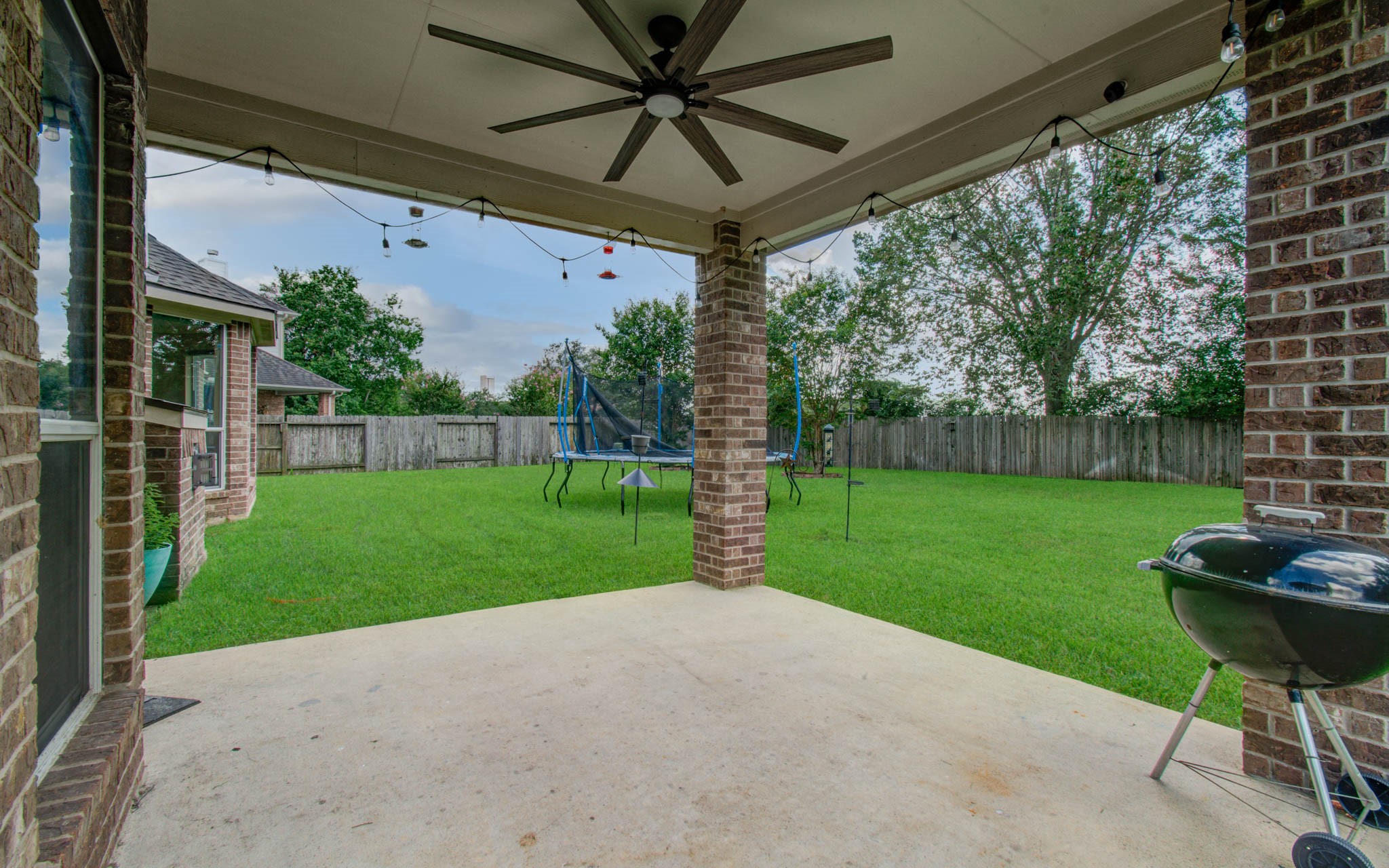 21331 Parham Circle Spring, TX 77388 - Photo 42 of 48 Covered patio is great for hosting barbecues and staying cool under the fan.
