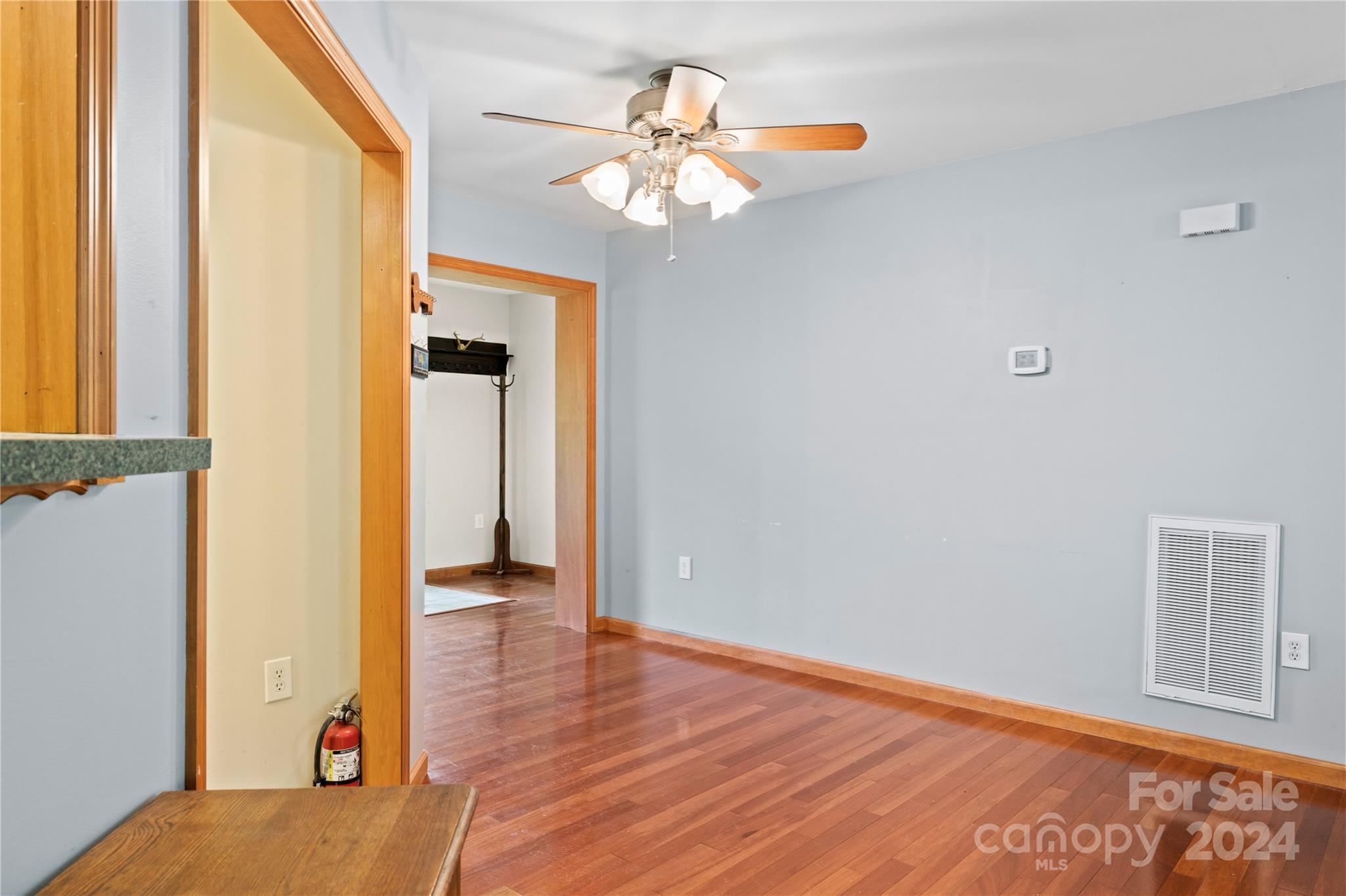 10 Bailey Ridge Road Black Mountain, NC 28711 - Photo 15 of 44 a view of a hallway with wooden floor and a chandelier