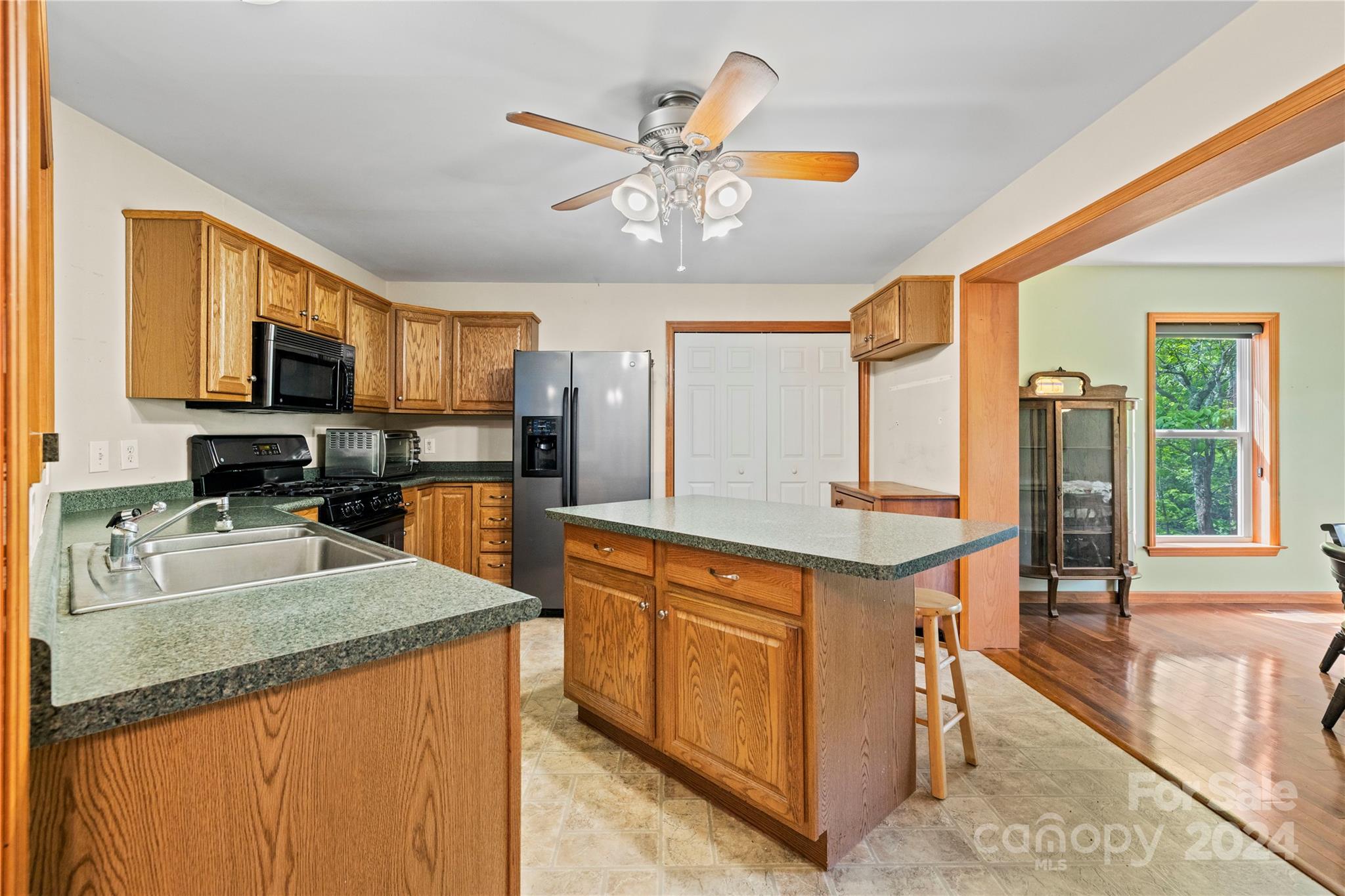 10 Bailey Ridge Road Black Mountain, NC 28711 - Photo 20 of 44 a kitchen with stainless steel appliances granite countertop a sink stove and refrigerator