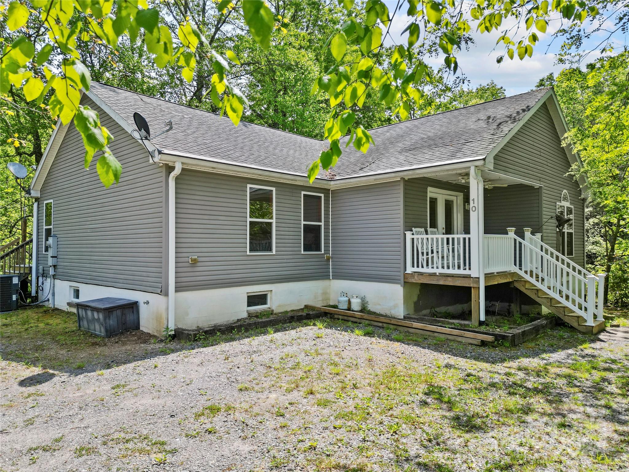 10 Bailey Ridge Road Black Mountain, NC 28711 - Photo 2 of 44 a front view of a house with garden