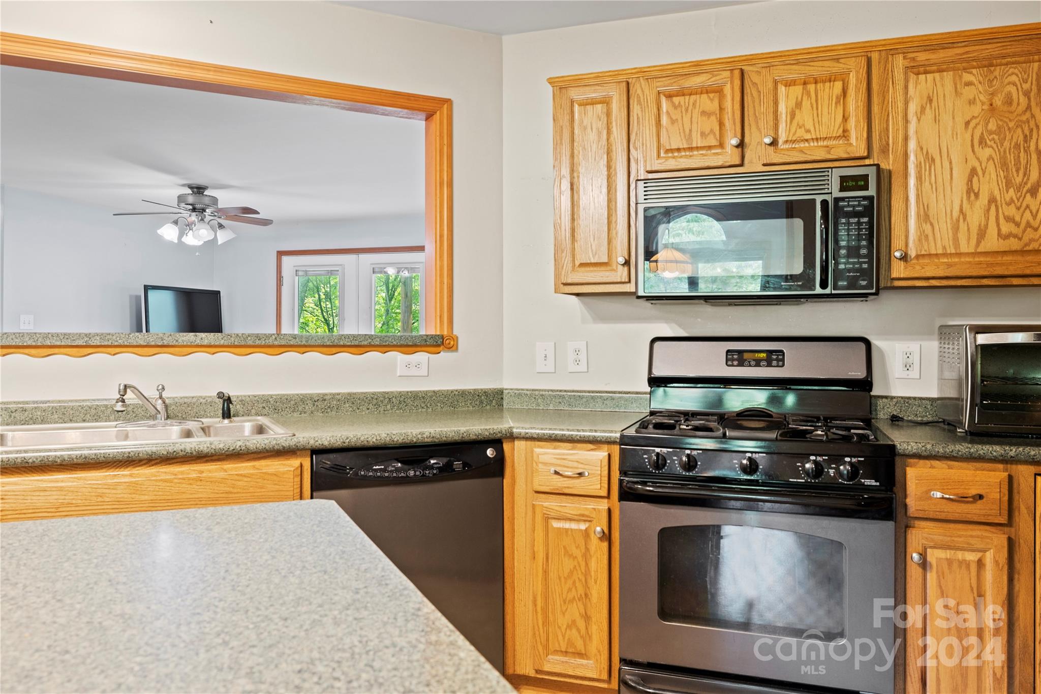 10 Bailey Ridge Road Black Mountain, NC 28711 - Photo 21 of 44 a kitchen with stainless steel appliances granite countertop a stove a sink and a microwave