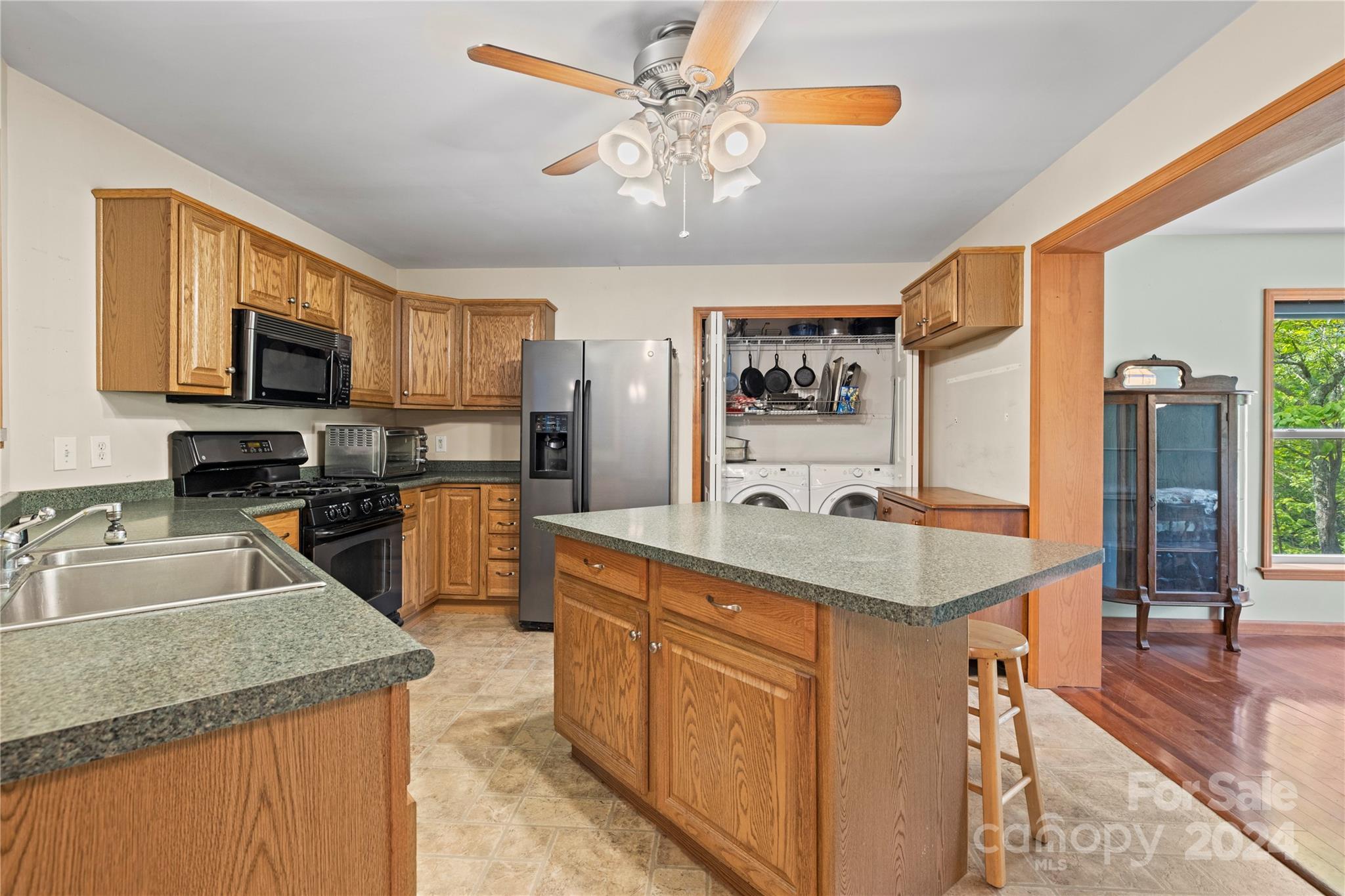 10 Bailey Ridge Road Black Mountain, NC 28711 - Photo 22 of 44 a kitchen with stainless steel appliances granite countertop a sink refrigerator stove and microwave