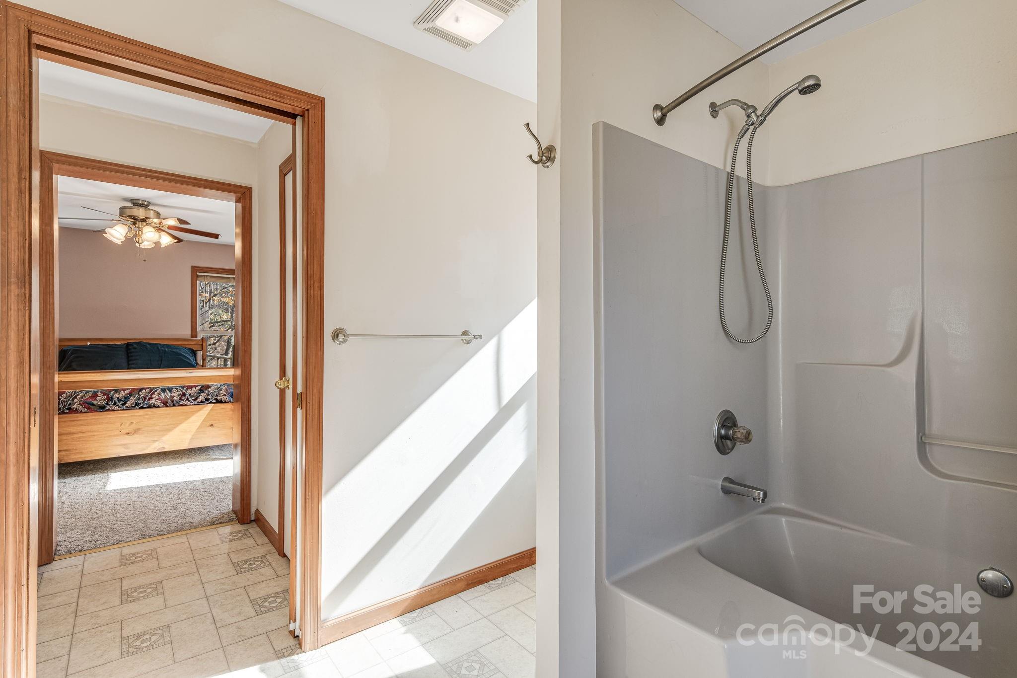 10 Bailey Ridge Road Black Mountain, NC 28711 - Photo 28 of 44 a bathroom with a tub and shower