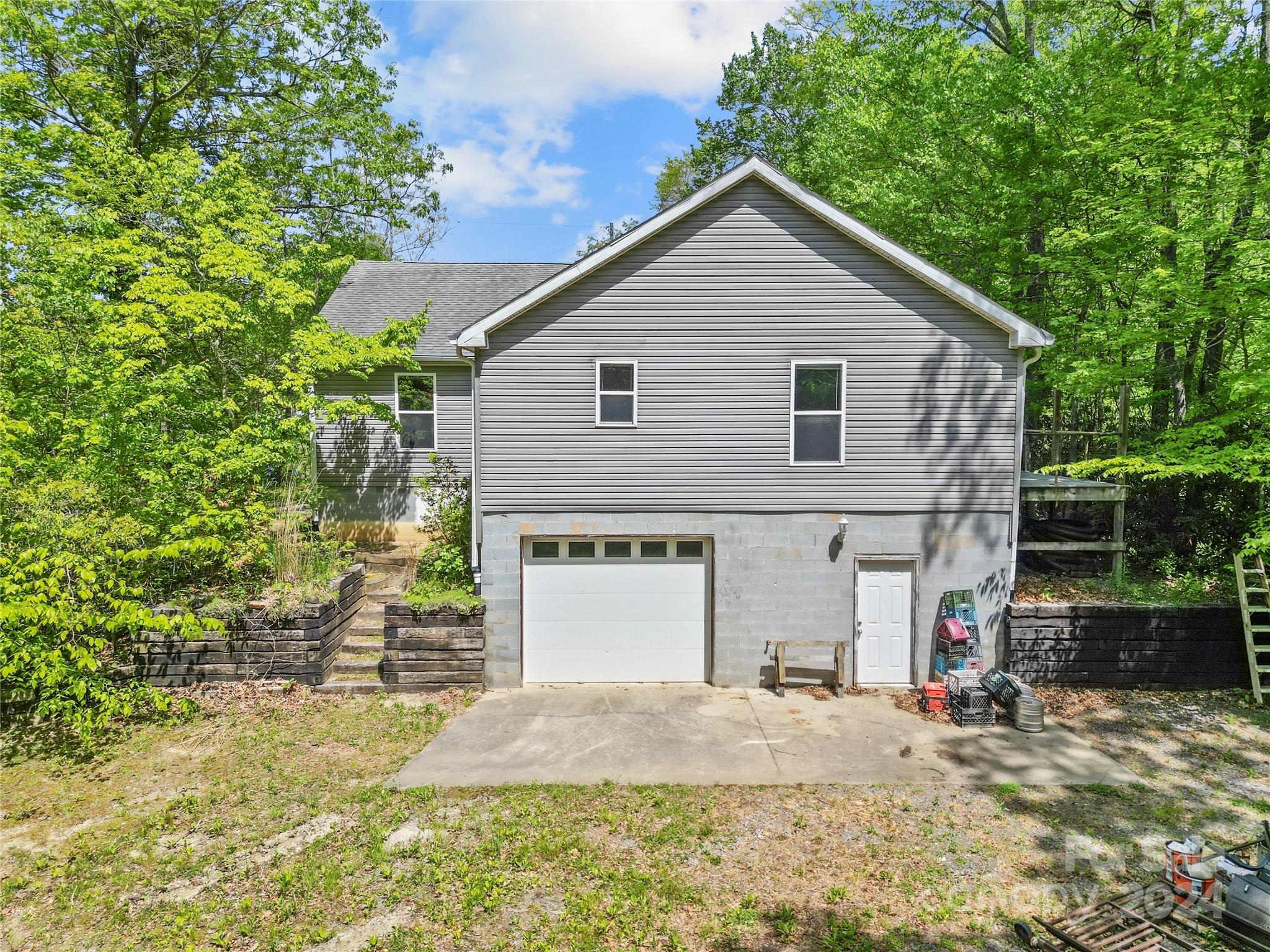 10 Bailey Ridge Road Black Mountain, NC 28711 - Photo 35 of 44 a front view of a house with a yard and garage