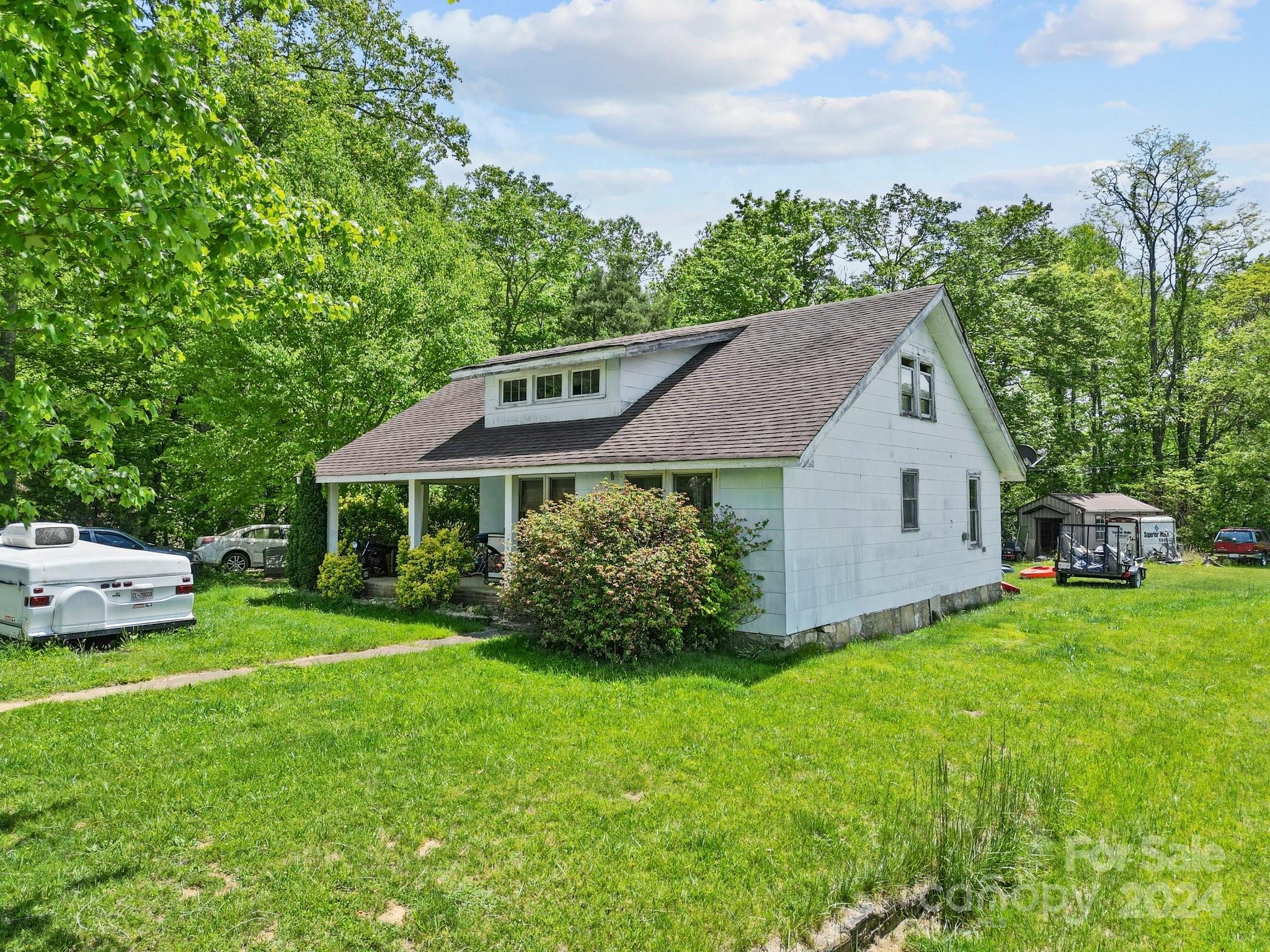 10 Bailey Ridge Road Black Mountain, NC 28711 - Photo 40 of 44 a view of a house with backyard and garden