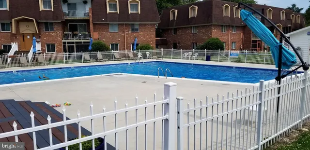 a view of building with yard and staircase