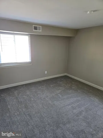 a view of a big room with closet and chandelier fan