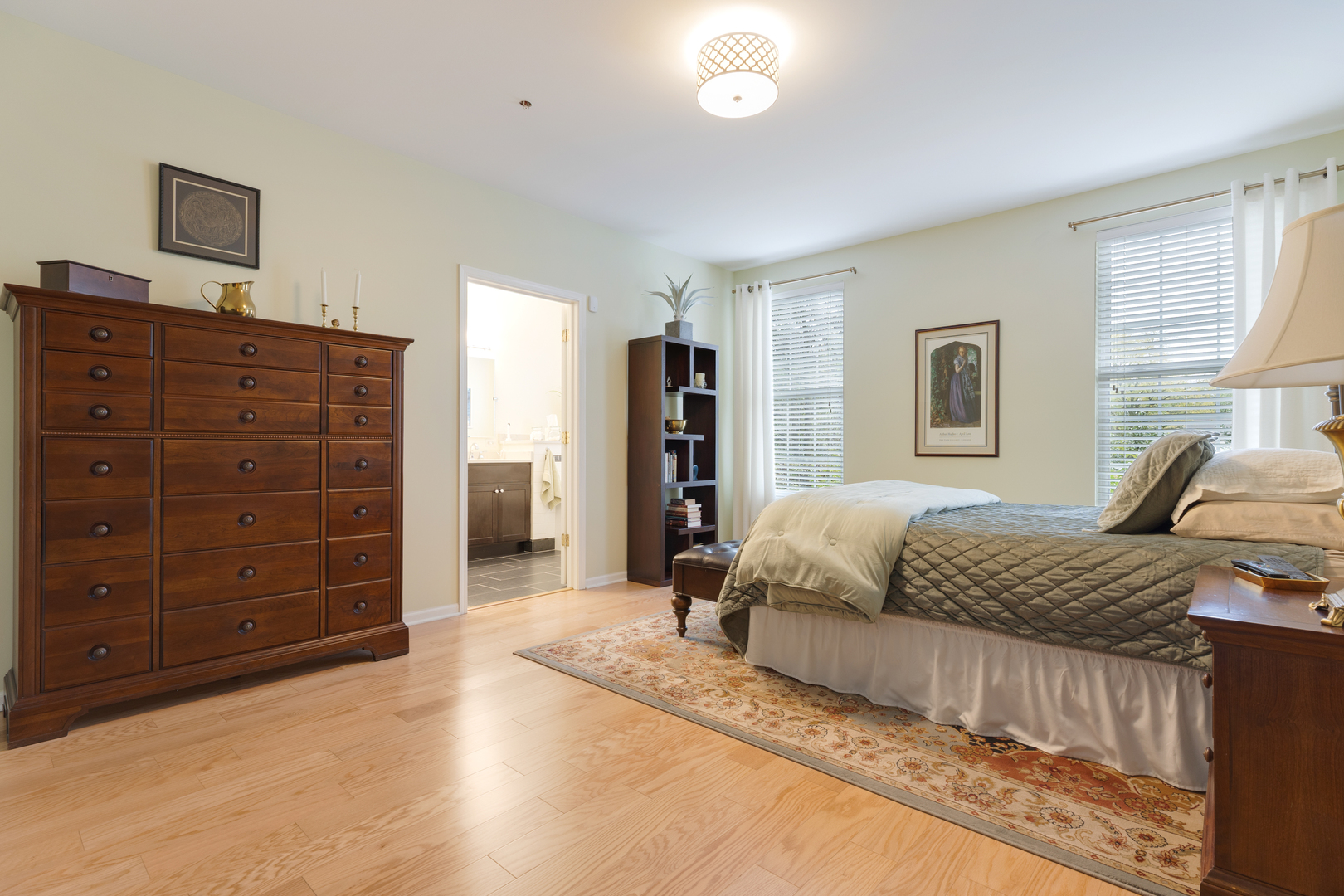 1386 Scarboro Road, Unit 1102 Schaumburg, IL 60193 - Photo 15 of 26 a spacious bedroom with a bed and a dresser