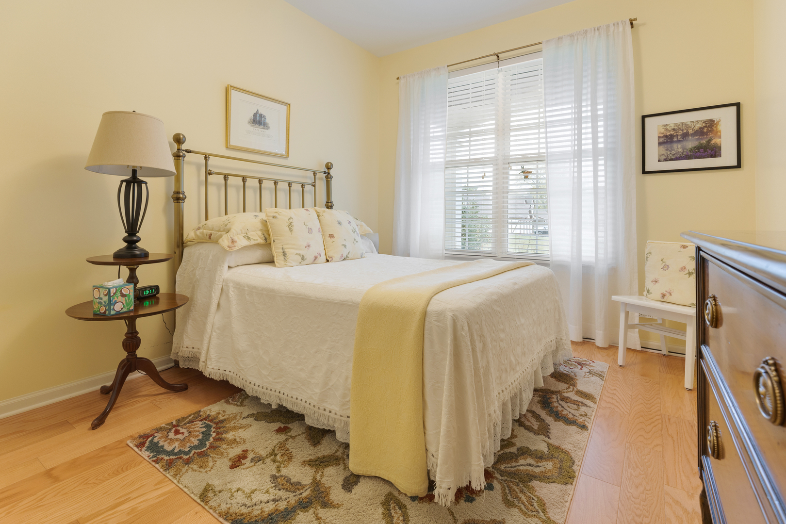 1386 Scarboro Road, Unit 1102 Schaumburg, IL 60193 - Photo 17 of 26 a bedroom with a bed and a lamp on table