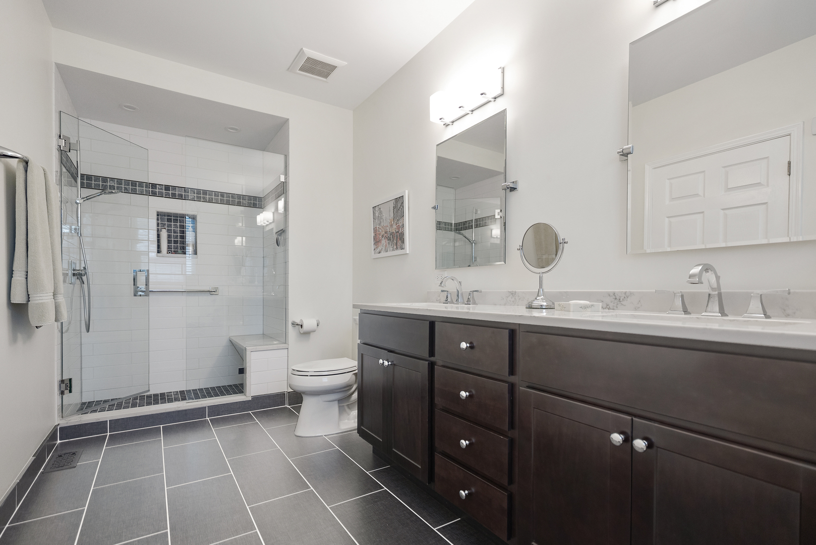 1386 Scarboro Road, Unit 1102 Schaumburg, IL 60193 - Photo 20 of 26 a bathroom with a double vanity sink mirror and toilet