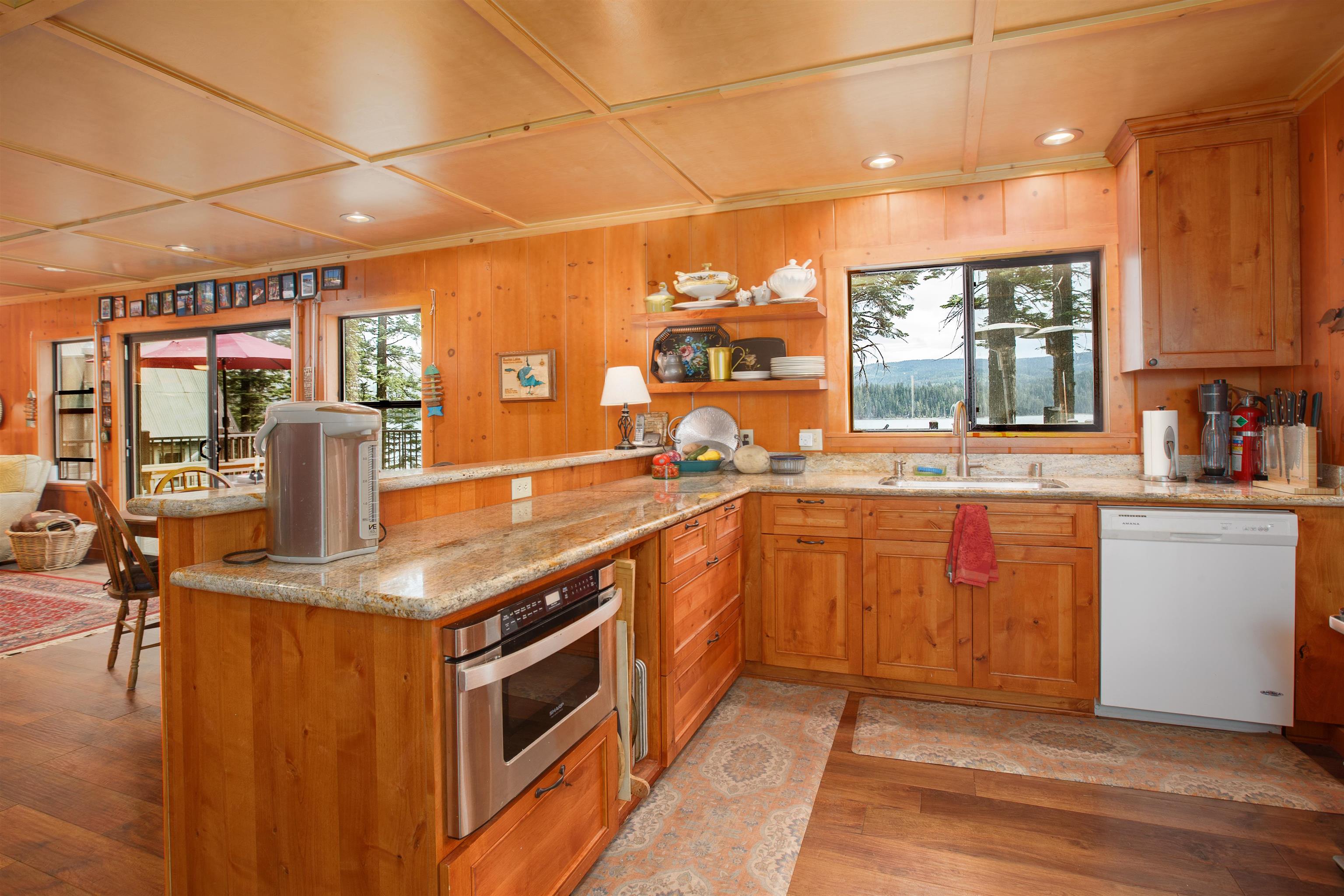 278 Mile High Road Quincy, CA 95971 - Photo 5 of 38 a kitchen with stainless steel appliances granite countertop a sink stove and cabinets