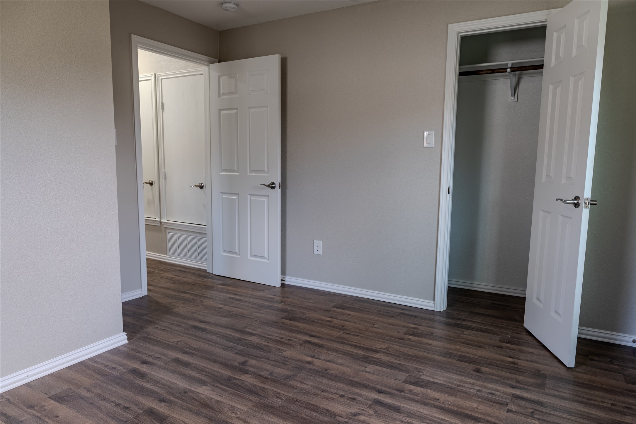 729 Planters Street Emory, TX 75440 - Photo 20 of 22 a view of an empty room with wooden floor and closet