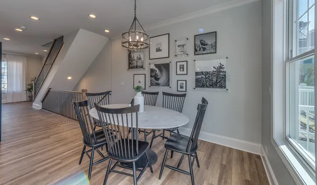 a view of a dining room with furniture window and wooden floor