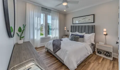 a bedroom with bed and a window