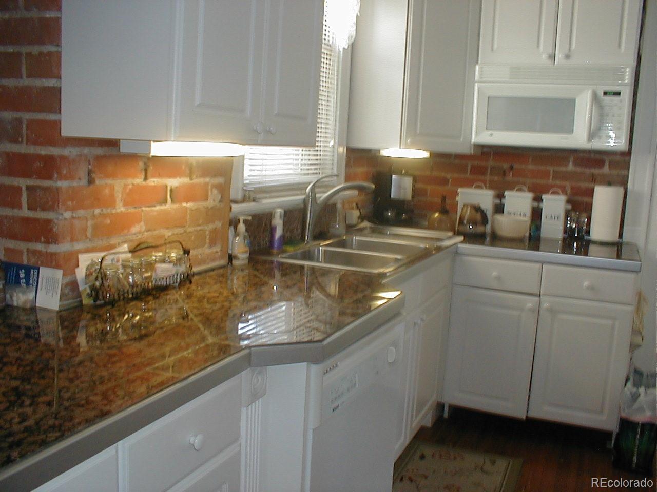 3732 Alcott Street Denver, CO 80211 - Photo 12 of 19 a kitchen with sink and cabinets