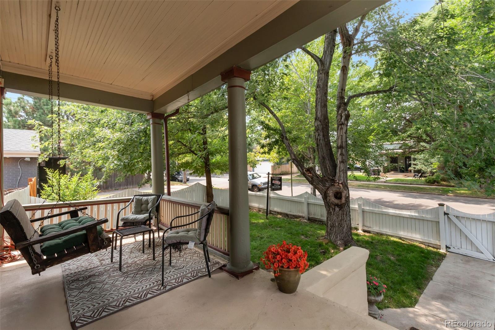 3732 Alcott Street Denver, CO 80211 - Photo 4 of 19 a view of a patio with couches and table and chairs and floor to ceiling window