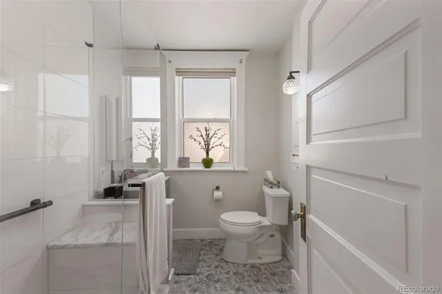 a bathroom with a toilet a sink and a bathtub