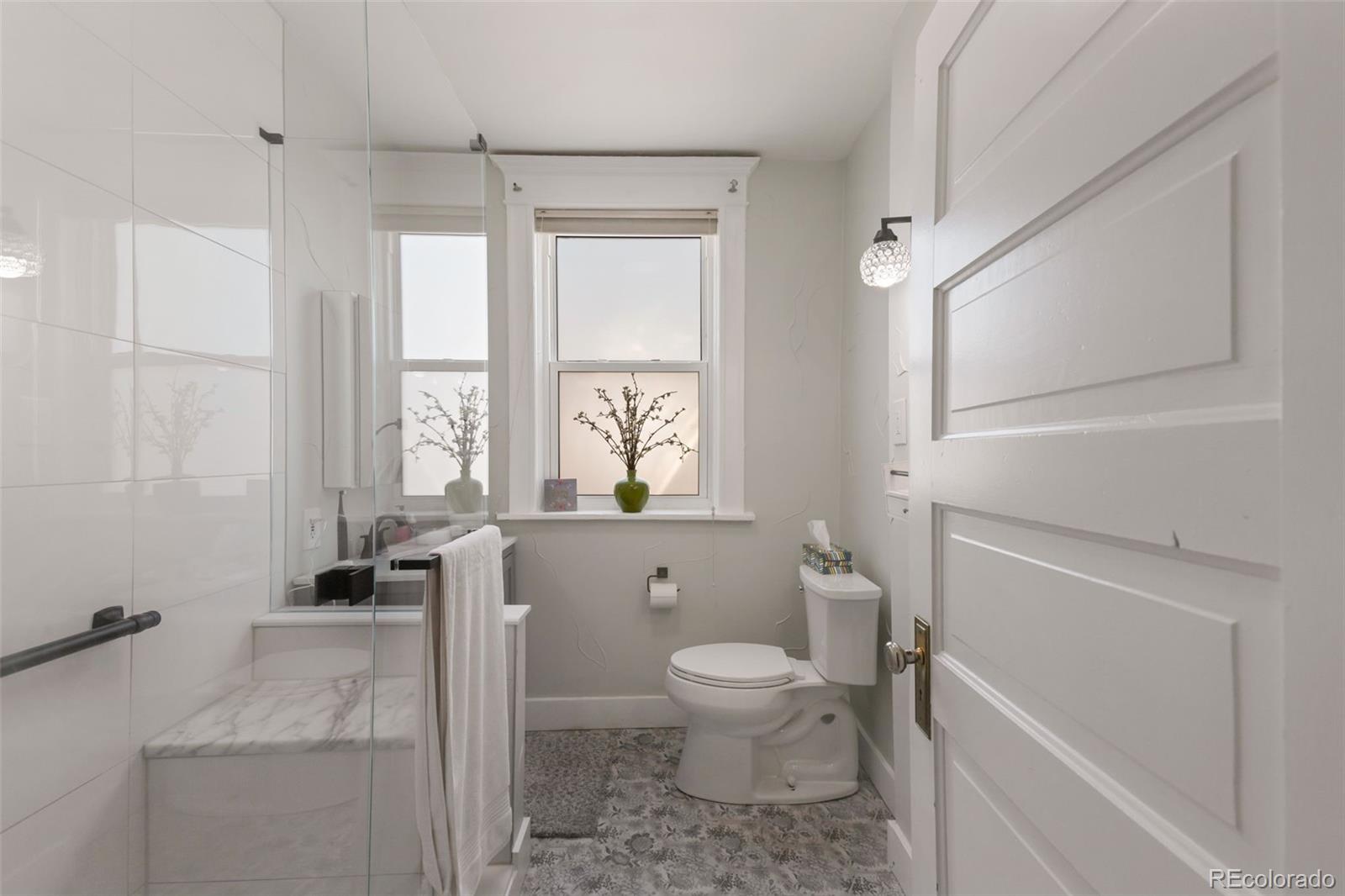 3732 Alcott Street Denver, CO 80211 - Photo 6 of 19 a bathroom with a toilet a sink and a bathtub