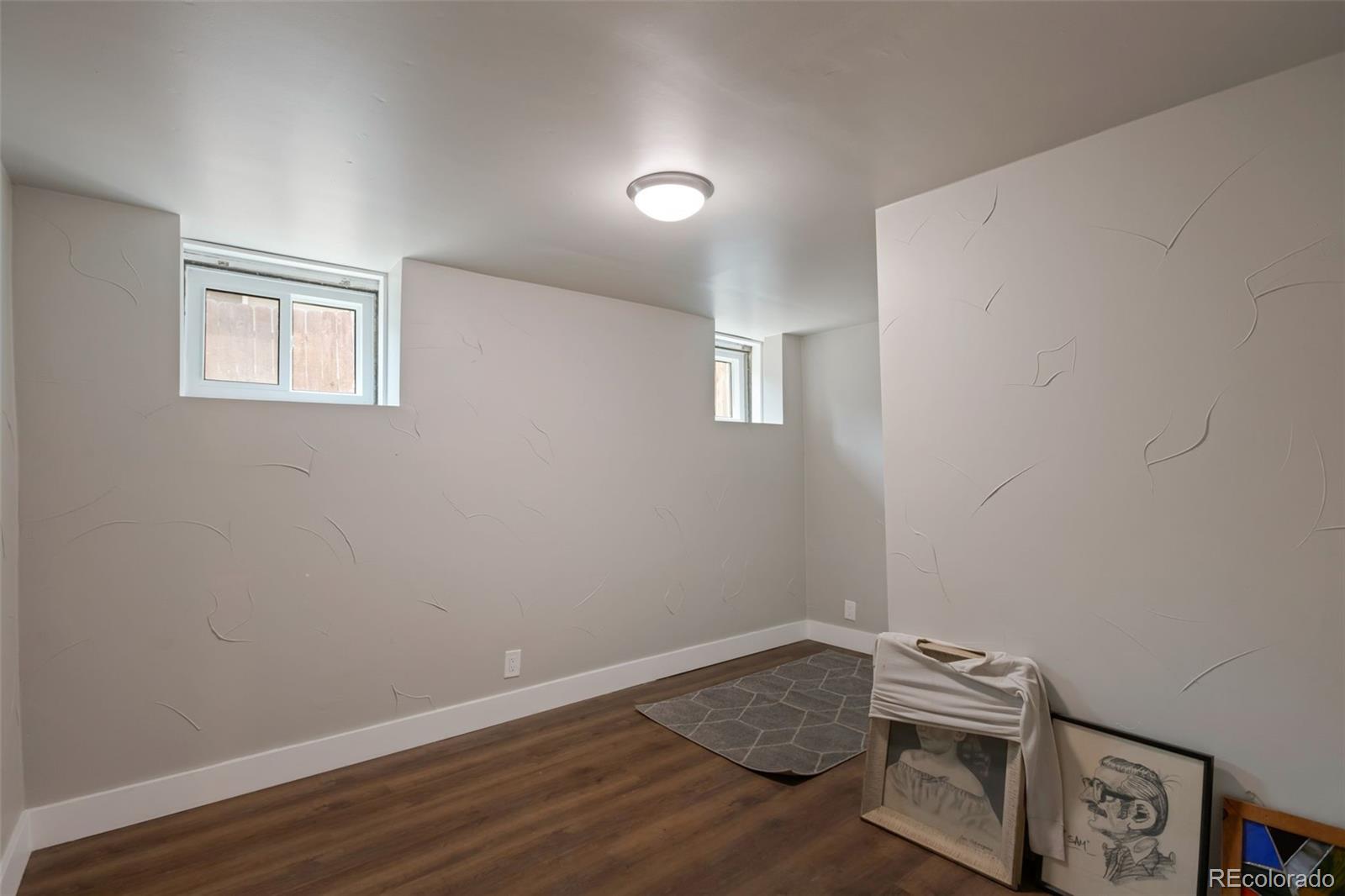 3732 Alcott Street Denver, CO 80211 - Photo 8 of 19 a room with wooden floor and a window