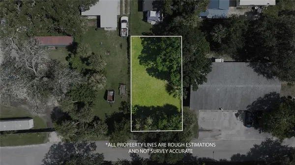 an aerial view of residential house with outdoor space