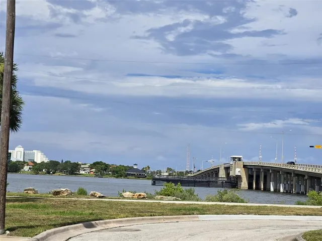 a view of a swimming pool with lawn chairs