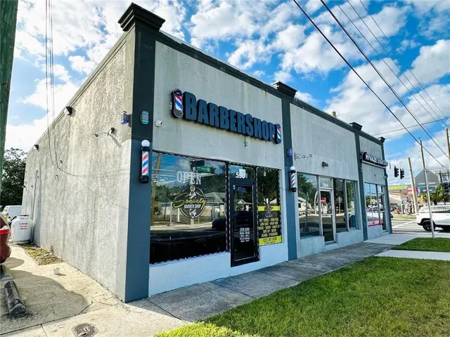 a view of a chairs and table in backyard
