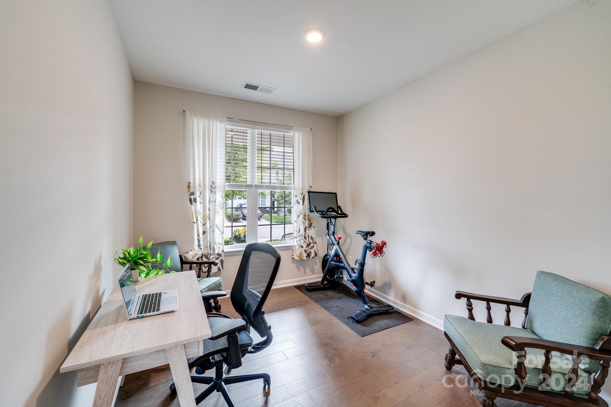 805 River Park Road Belmont, NC 28012 - Photo 11 of 21 a view of a workspace with furniture and a window