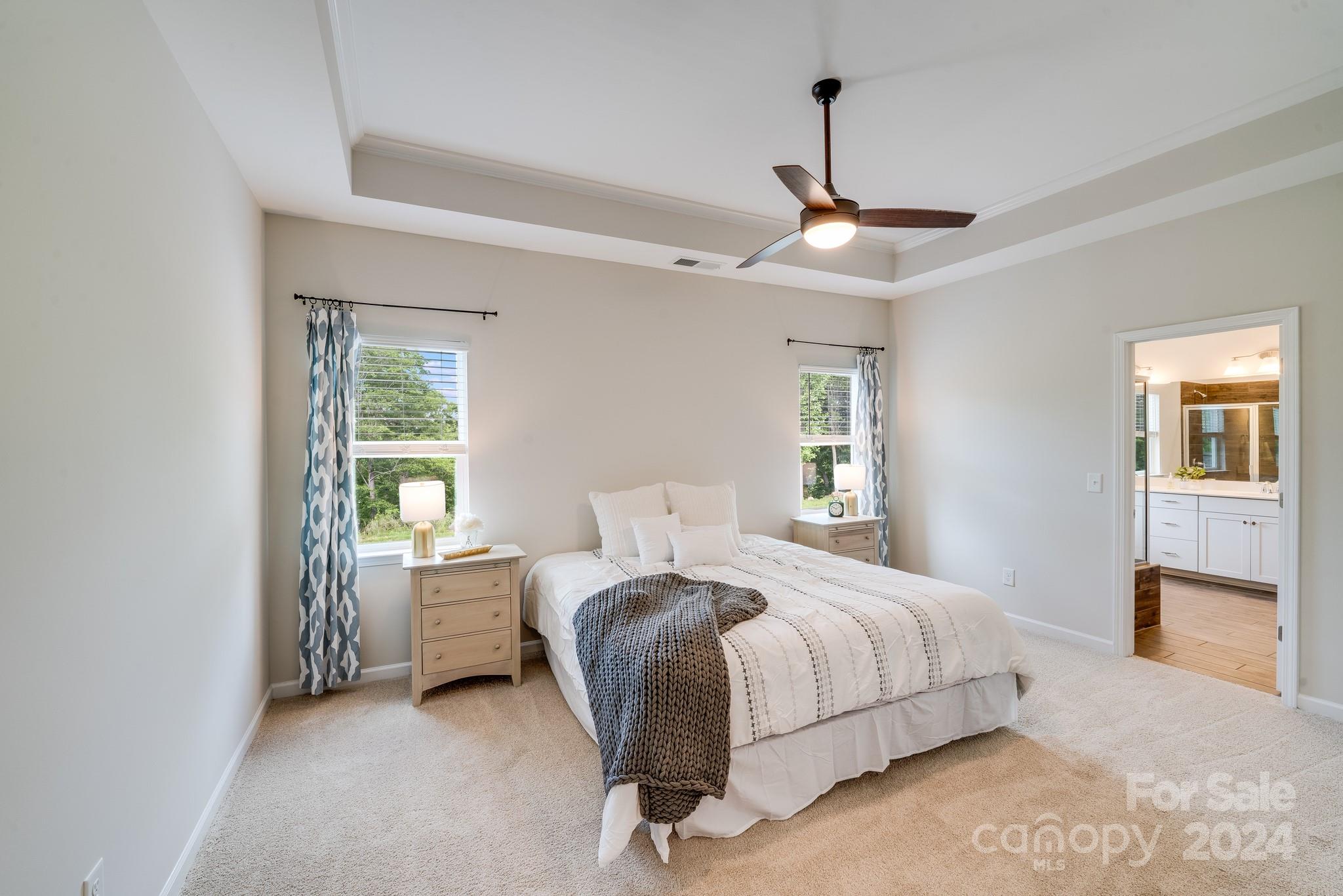 805 River Park Road Belmont, NC 28012 - Photo 12 of 21 a bedroom with a bed ceiling fan and a window