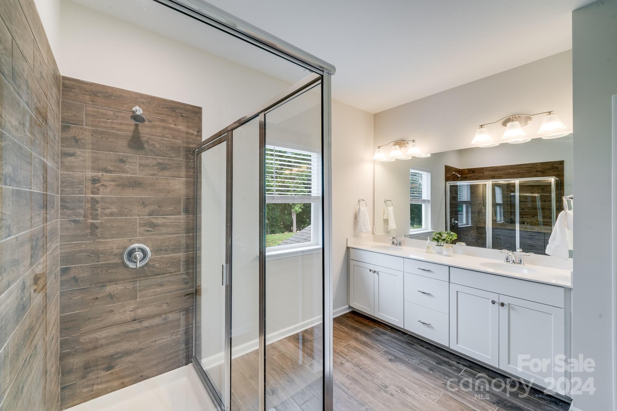 805 River Park Road Belmont, NC 28012 - Photo 14 of 21 a bathroom with a double vanity sink and mirror