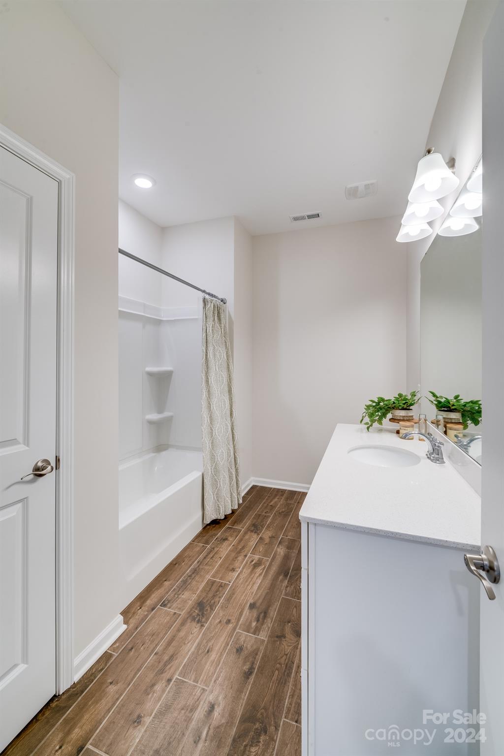 805 River Park Road Belmont, NC 28012 - Photo 17 of 21 a bathroom with a sink mirror and a bathtub