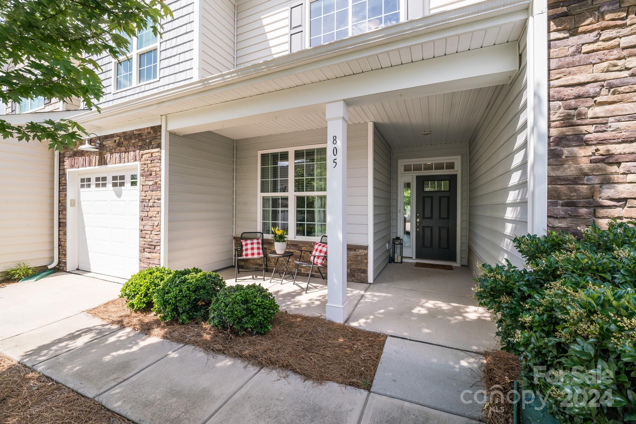 805 River Park Road Belmont, NC 28012 - Photo 2 of 21 a front view of a house with outdoor seating and plants