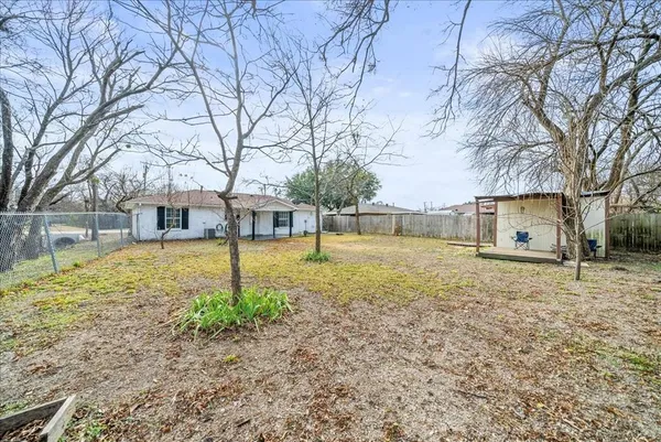 a house with trees in front of it