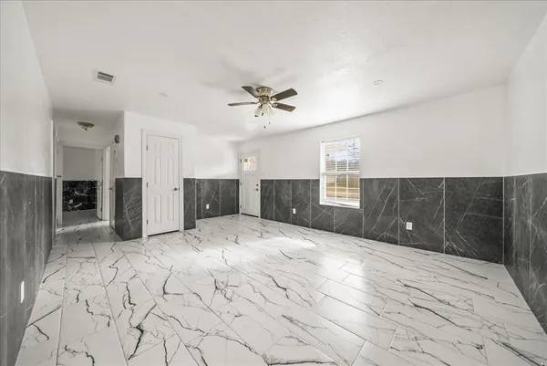 a view of kitchen with a sink and a refrigerator