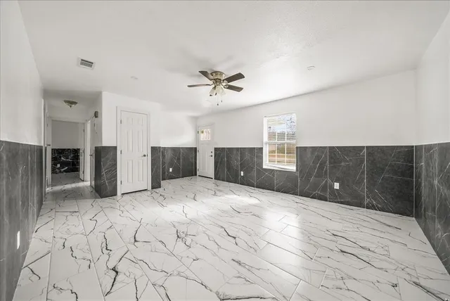 a view of kitchen with a sink and a refrigerator