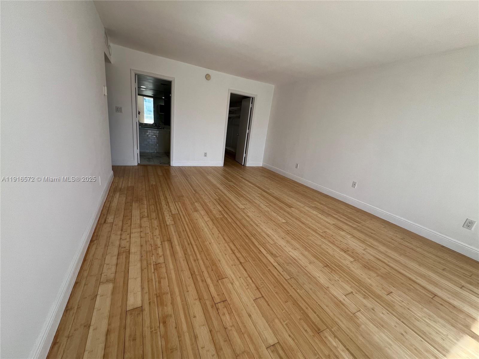 5600 Collins Avenue, Unit 17T Miami Beach, FL 33140 - Photo 24 of 52 a view of wooden floor in a room