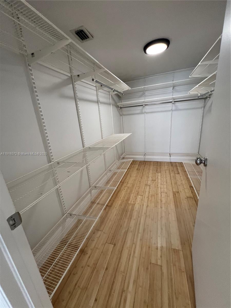 5600 Collins Avenue, Unit 17T Miami Beach, FL 33140 - Photo 28 of 52 a view of a room with wooden floor