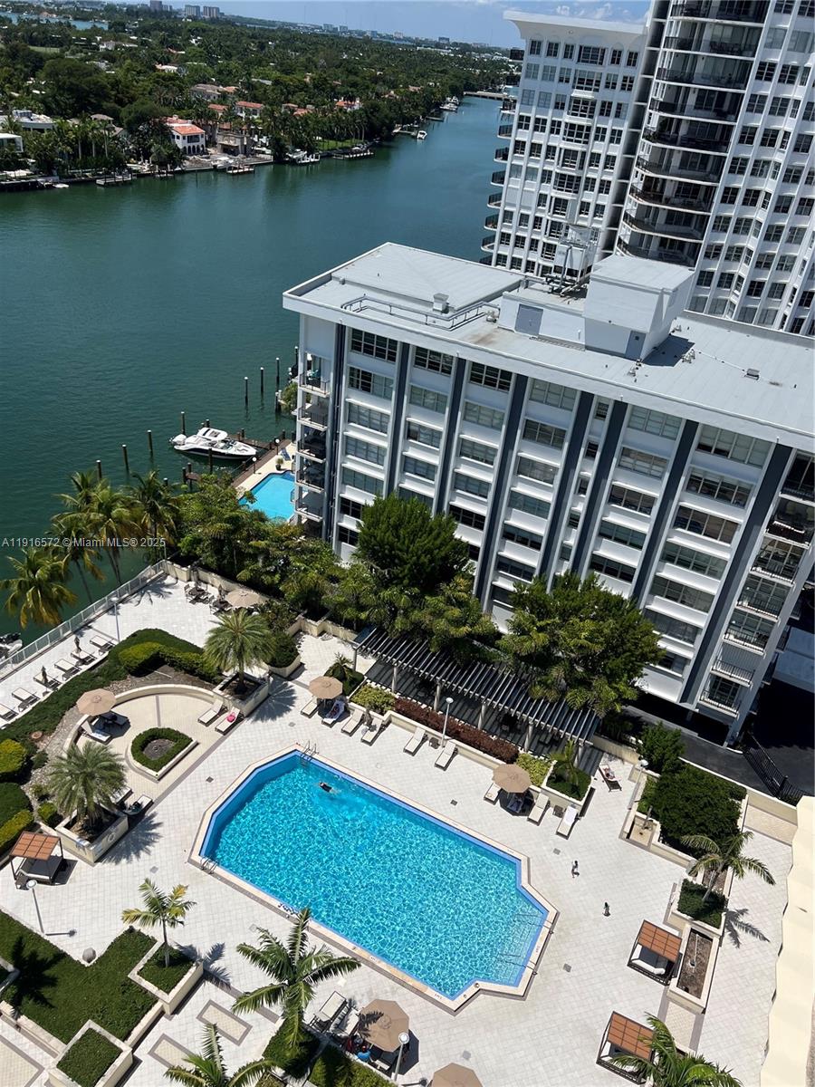 5600 Collins Avenue, Unit 17T Miami Beach, FL 33140 - Photo 37 of 52 a view of a balcony with chairs and potted plants