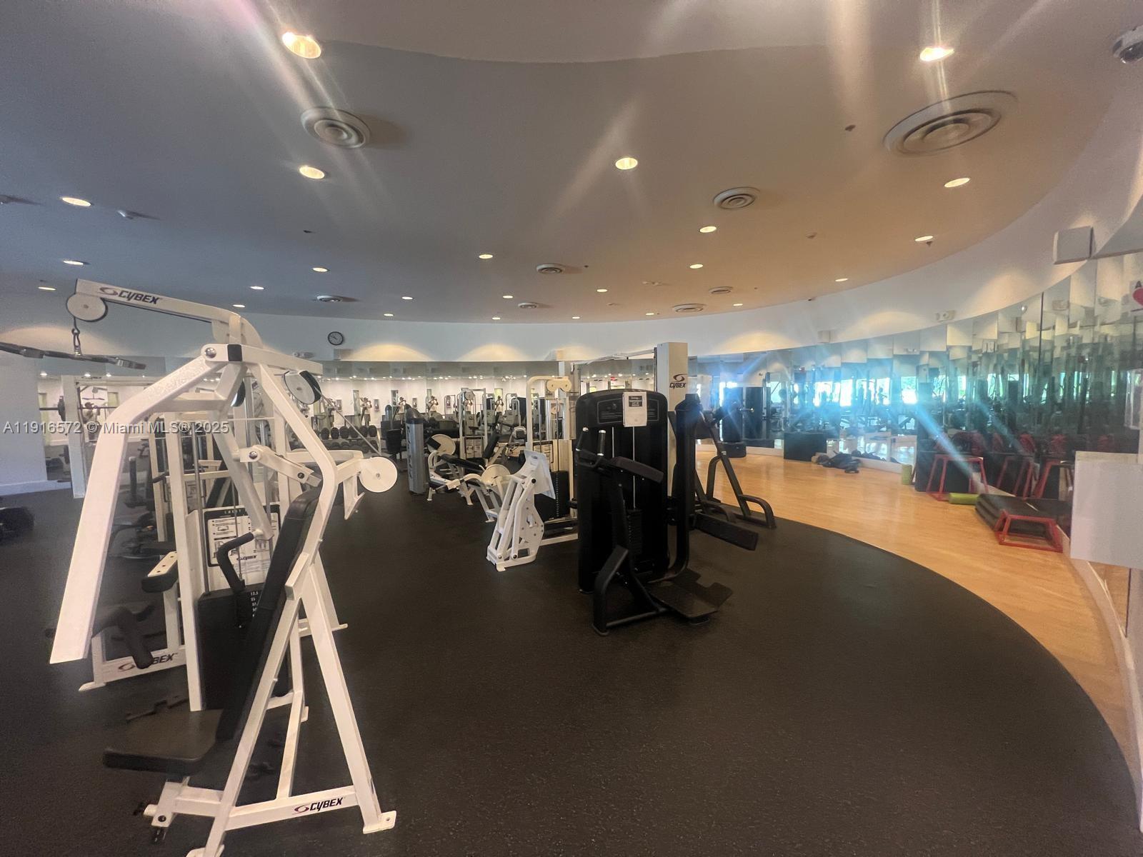 5600 Collins Avenue, Unit 17T Miami Beach, FL 33140 - Photo 46 of 52 a view of a room with gym equipment