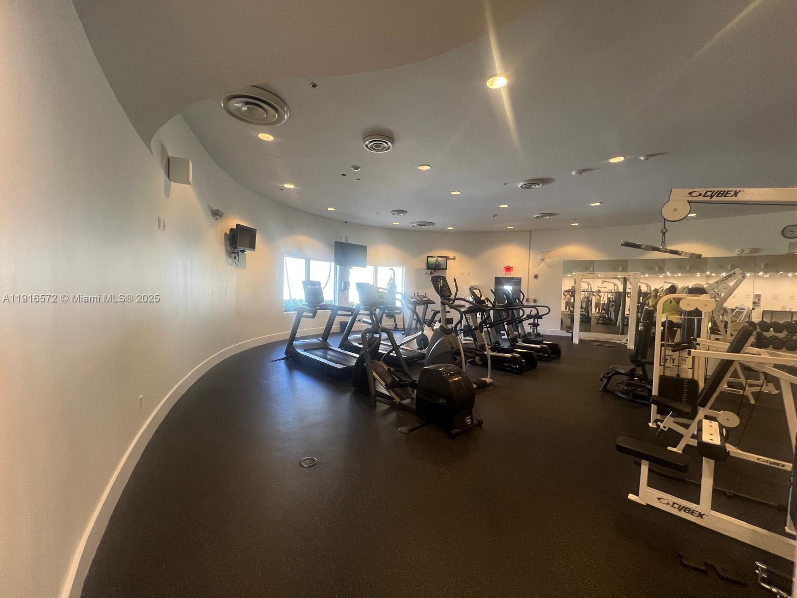 5600 Collins Avenue, Unit 17T Miami Beach, FL 33140 - Photo 47 of 52 a view of a room with gym equipment