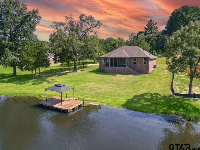 a view of a swimming pool with a garden
