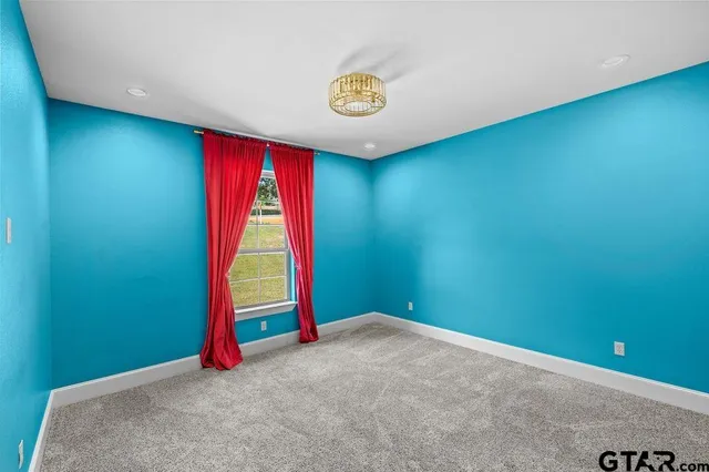 a view of a room with air conditioner and windows