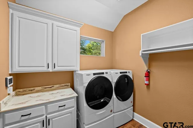 a utility room with dryer and washer