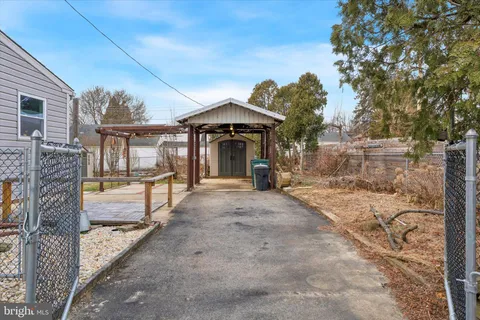 a view of a porch with furniture and a yard