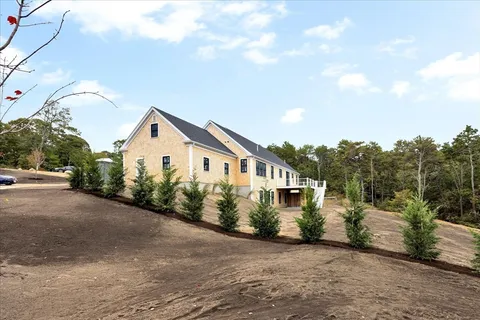 a view of a house with a street