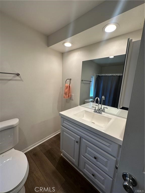 12830 6th Street, Unit 14 Yucaipa, CA 92399 - Photo 14 of 16 a bathroom with a sink a toilet and mirror
