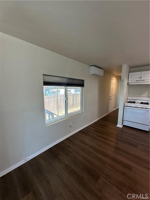 12830 6th Street, Unit 14 Yucaipa, CA 92399 - Photo 8 of 16 a view of empty room with wooden floor