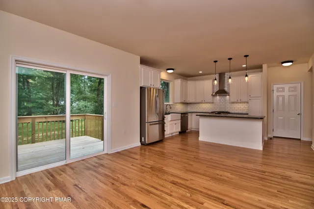 a view of kitchen with wooden floor