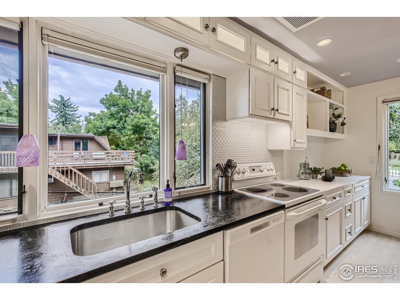 815 Alpine Avenue, Unit 4 Boulder, CO 80304 - Photo 13 of 27 a kitchen that has a sink and a stove