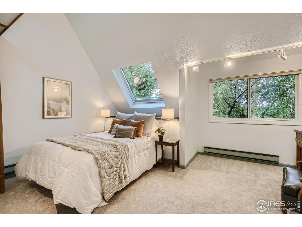 815 Alpine Avenue, Unit 4 Boulder, CO 80304 - Photo 16 of 27 a bedroom with a bed and a large window