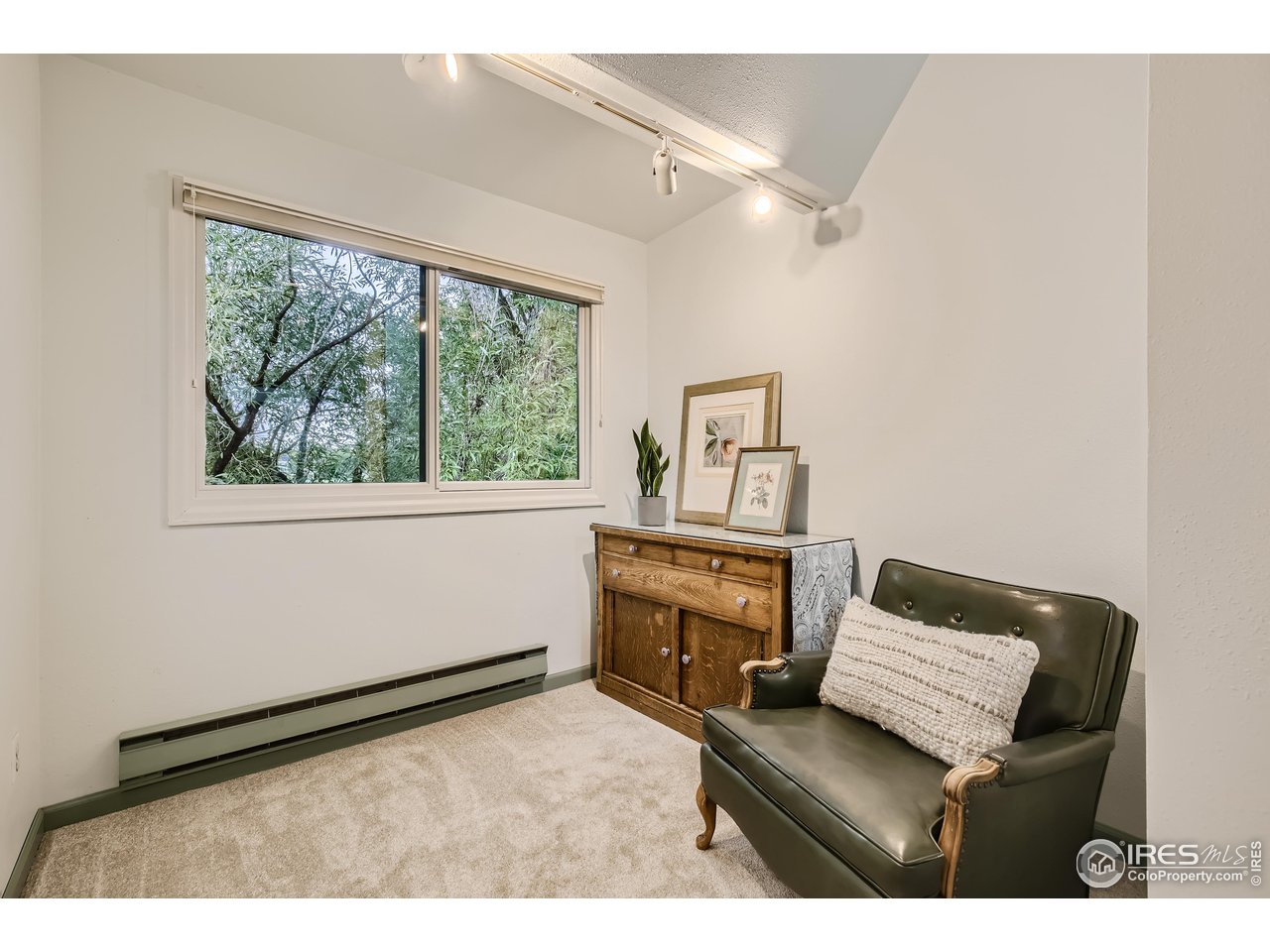 815 Alpine Avenue, Unit 4 Boulder, CO 80304 - Photo 22 of 27 a living room with furniture and a window